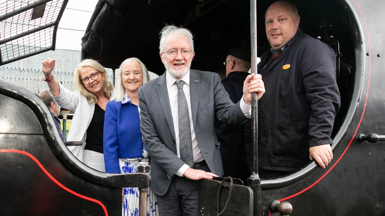 (L-r): Virginia Teehan, CEO Heritage Council;
Martina Moloney, chair, Heritage Council;
Minister of State for Nature, Heritage and Electoral Reform, Malcolm Noonan 
beside a steam engine  marking the launch of National Heritage Week at Connolly Station, Dublin. Image source: Gareth Chaney