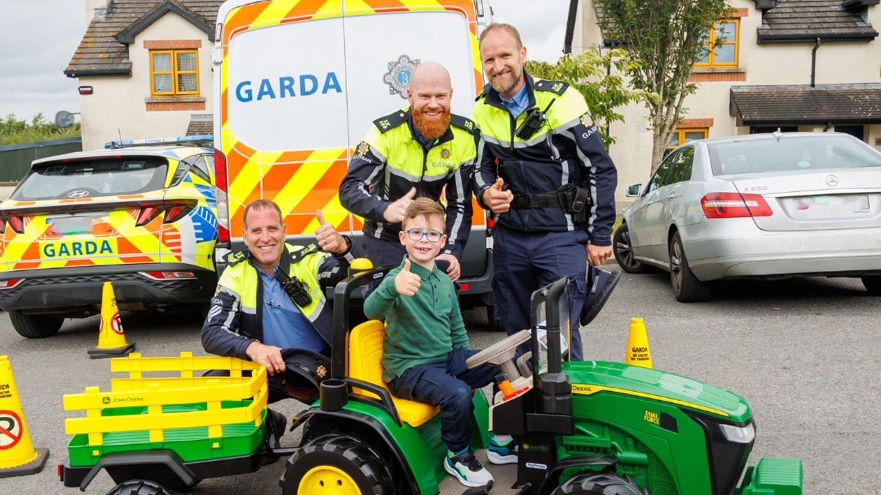 Garda Martin, Garda Quinlan and Sgt Carey with Fíonn on his tractor Source: Make-A-Wish Ireland