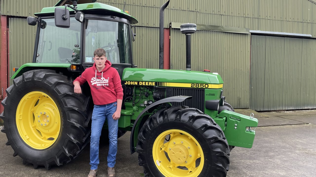 Eoin Sheridan pictured beside his fully-restored John Deere 2850