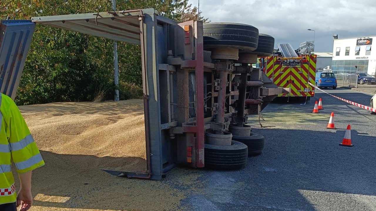 Grain spilled as trailer overturns in Waterford