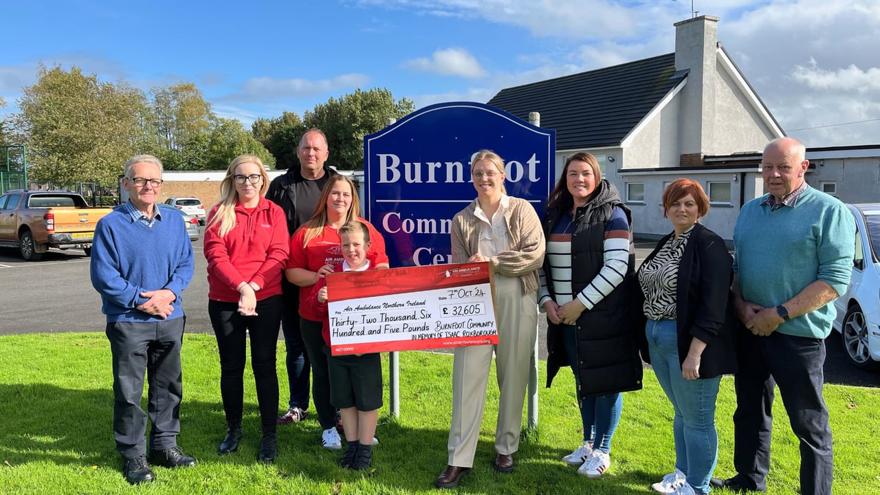 L-R: Boyd Douglas, chairperson of Burnfoot Community Association, Katrina Hughes, Isaac's parents Mark and Katrina Roxborough, Isaac's youngest brother James, Carolyn Scott, Tracy Moore, Jeanette O'Neill and Don Laughlin from Burnfoot Community Association.

