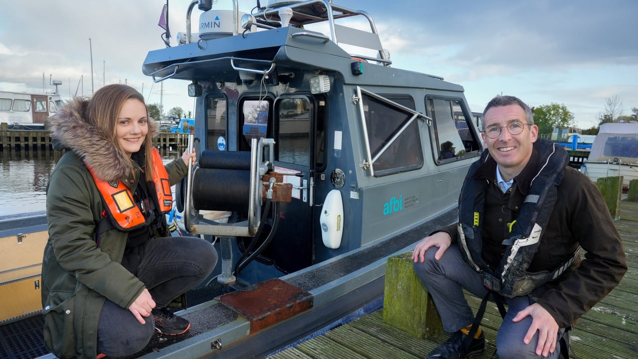 Faye Shiels, AFBI Freshwater scientist, with DAERA Minister Andrew Muir pictured at the handover of the research vessel SALAR to monitor Lough Neagh