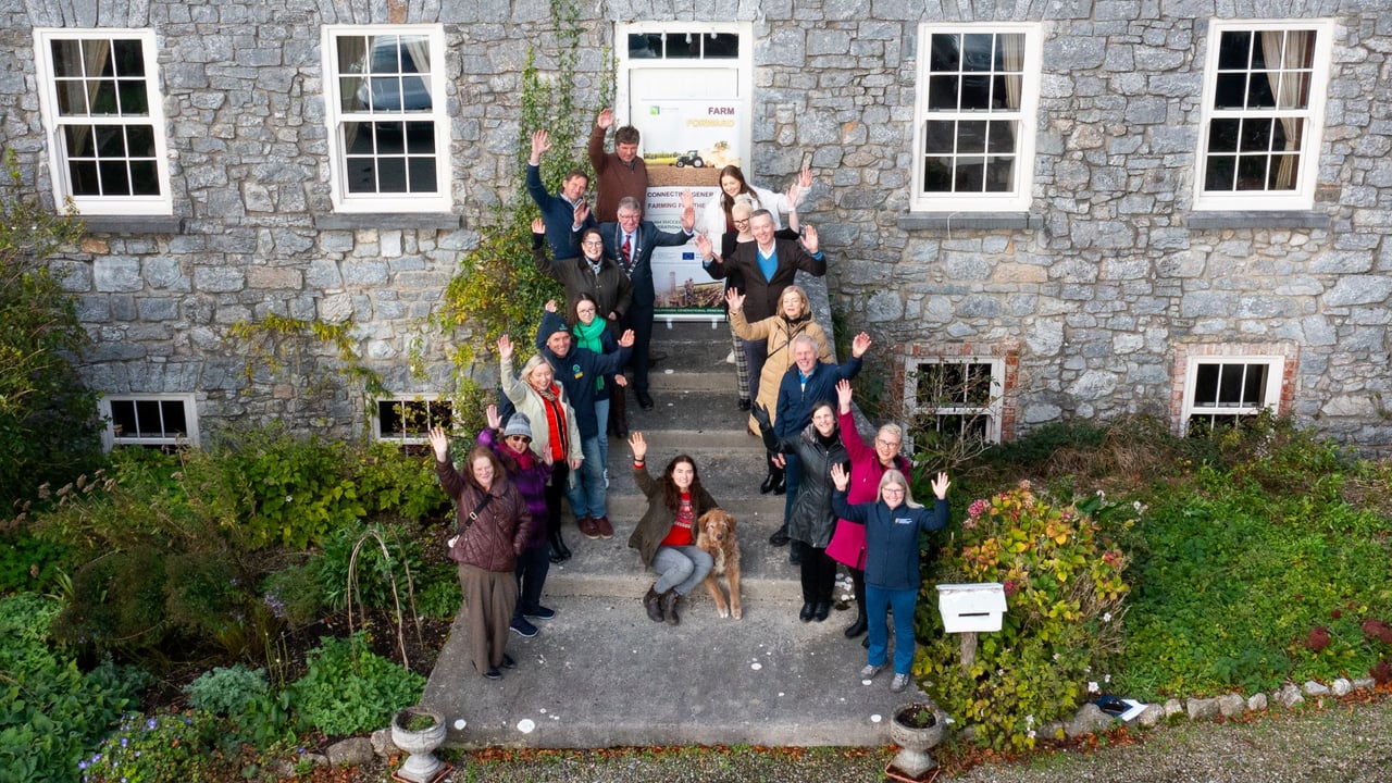 Left side (front to back): Rosemarie Fitzgerald; Clare Jordan; Carrie O'Donoghue; James O'Donnell; Juliette (French student); Aisling Lewis; Cllr. Ian Doyle, deputy mayor Cork County Council; Aidan Gleeson; Shay Galvin. Right Side (front to back): Tracey O'Donoghue; Amanda Slattery; Anne Maguire; Gerald Quain; Cllr. Deirdre O'Brien; Brian McGee; Louise Crowley; Aine Collopy. Middle: Hannah Quinn Mulligan and Jim the dog