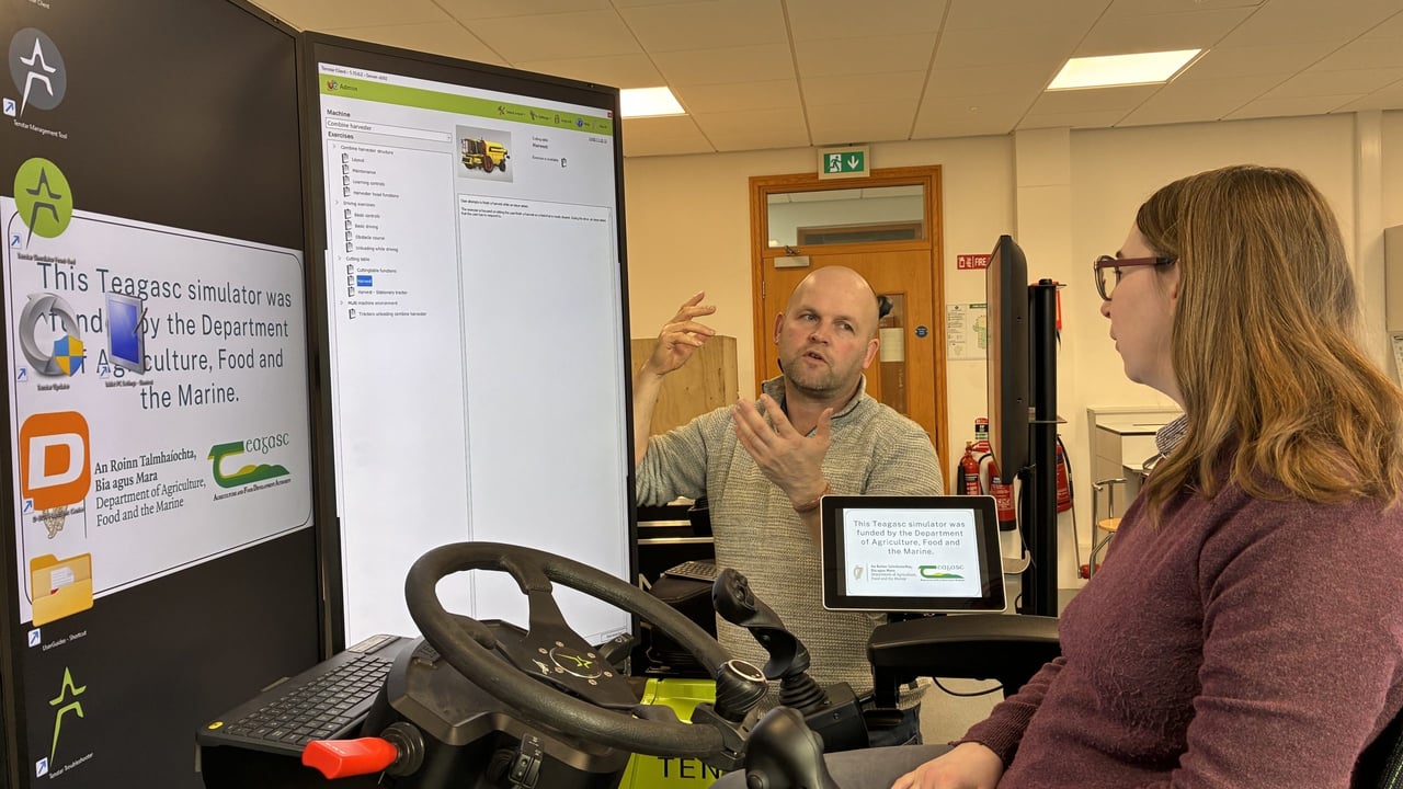 Professor Florence Becot, US farm safety expert is pictured seated on one of the Department of Agriculture, Food and the Marine (DAFM)–funded machinery simulators at the Teagasc College of Amenity Horticulture. Also pictured is Paddy Smith, college lecturer, who is providing an overview of the simulator.