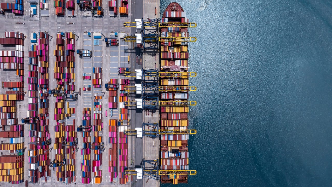 Aerial view of a container cargo ship at a port 