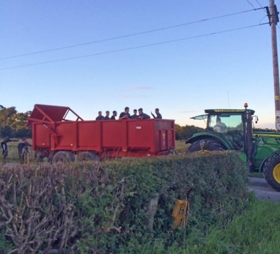 Soccer team hitches lift off tractor and trailer after coach breaks down