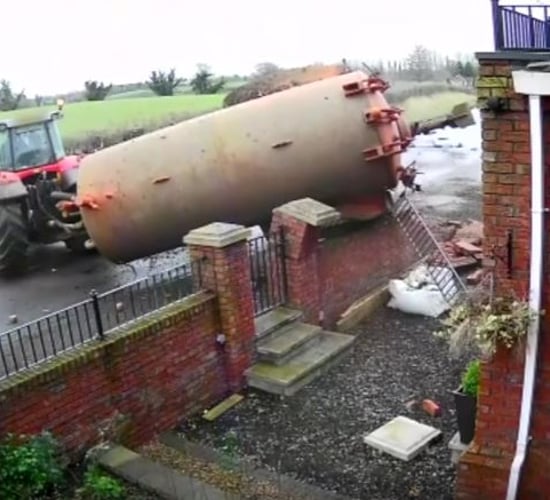 Video: Dramatic footage of slurry tank crashing through a garden wall