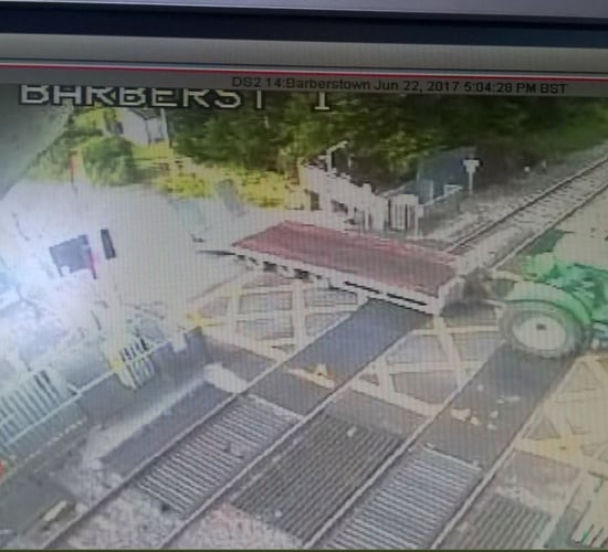 Train services disrupted as tractor destroys level crossing