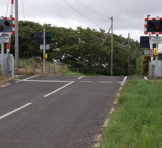 Video: Speeding train narrowly avoids crashing into tractor at level crossing