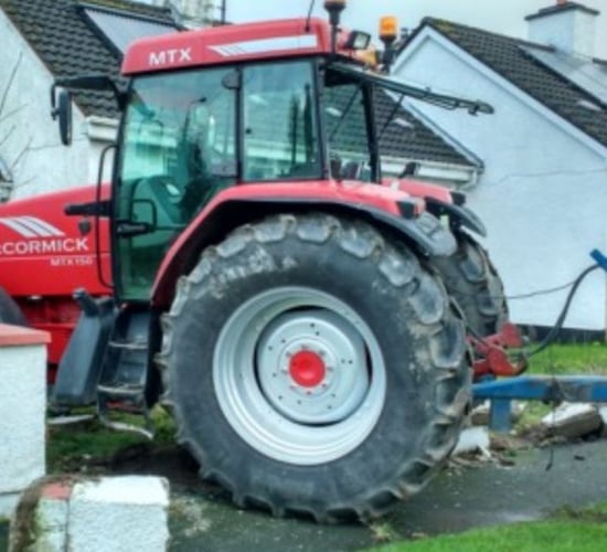 Pics: Tractor ends up in pensioner's garden after crashing through wall