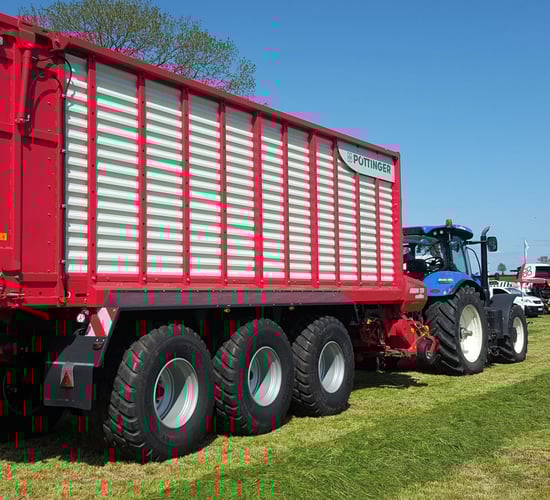 Grass & Muck: 3-axle monster flies flag for wagon fanatics