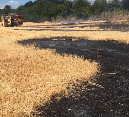 Sparks from combine blade ignites field fire