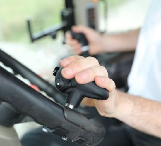 Clever steering knob that 'transforms' tractor/loader work
