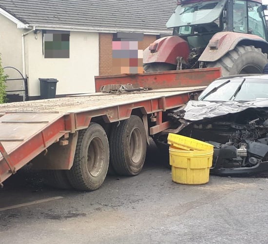 Road collision involving tractor causes traffic delays