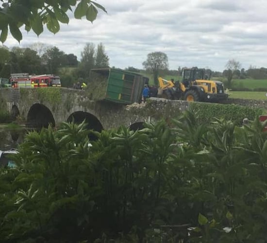Narrow escape as silage trailer overturns on bridge