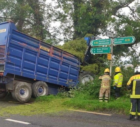 Crane brought in to extract tractor from collision scene