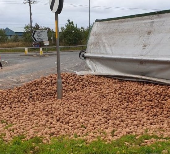 Trailer transporting potatoes overturns on Scottish road
