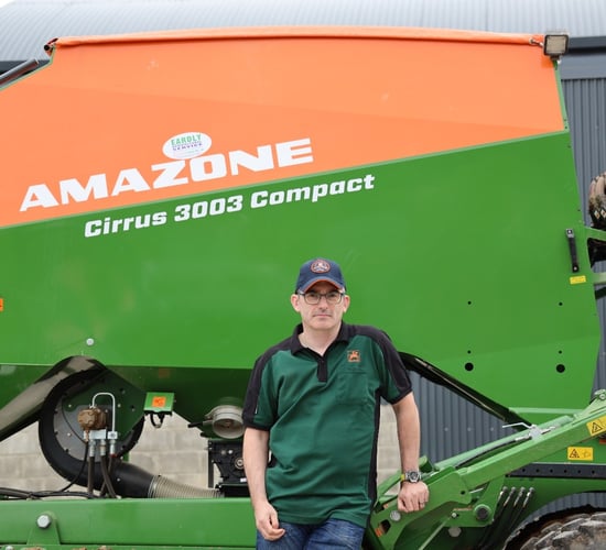 What trailed drill does this tillage farmer choose for planting his own corn?