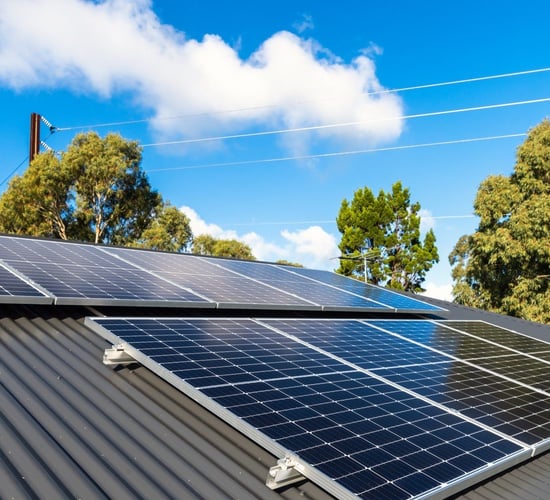 Who is eligible to sell surplus electricity back to the grid?