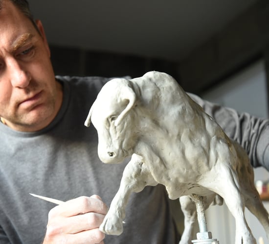 Sculpture depicting bulls and cattle carves out niche for artist