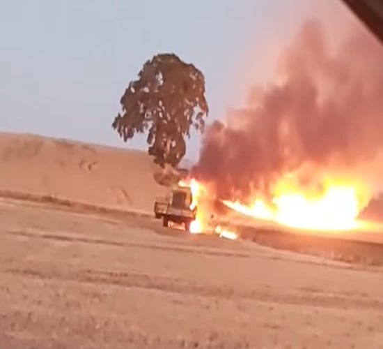 Video: Combine harvester catches fire as temperatures soar