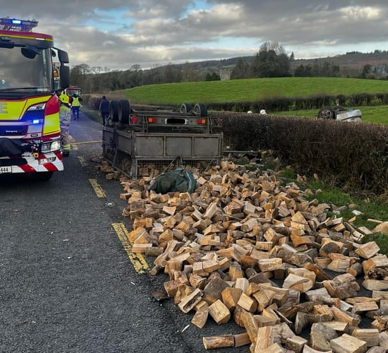 Car collides with trailer carrying logs on Laois road