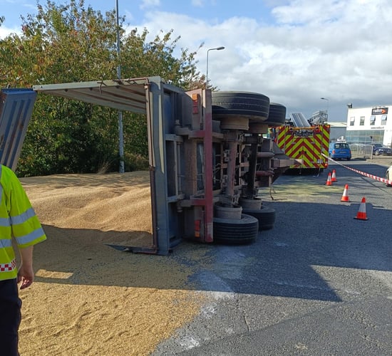 Grain spilled as trailer overturns in Waterford