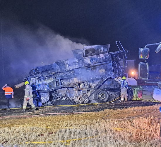 Fire crews and farmers tackle combine blaze in the UK