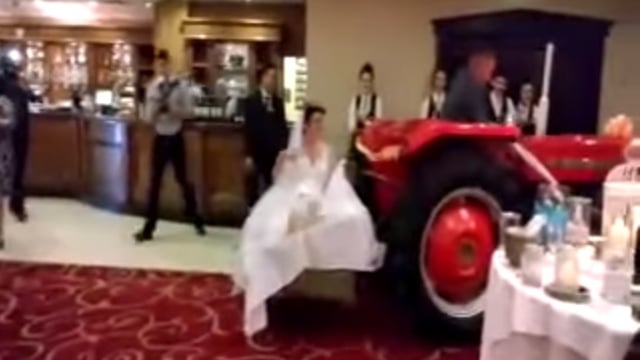 Video: A bride arrived to her wedding reception on a transport box