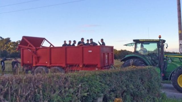 Soccer team hitches lift off tractor and trailer after coach breaks down
