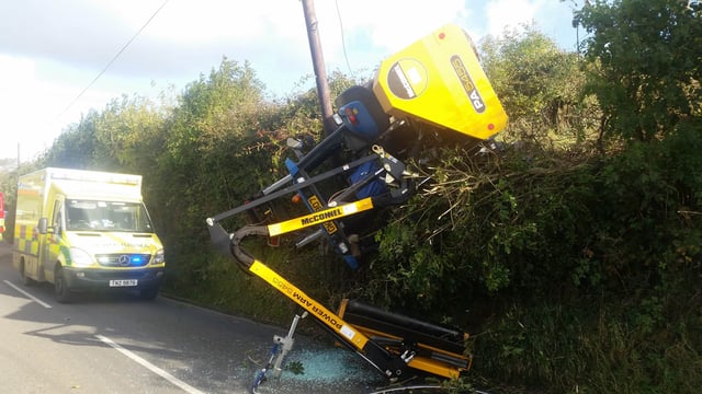 Pics: Farmer has 'lucky escape' as tractor overturns while hedgecutting