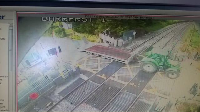 Train services disrupted as tractor destroys level crossing