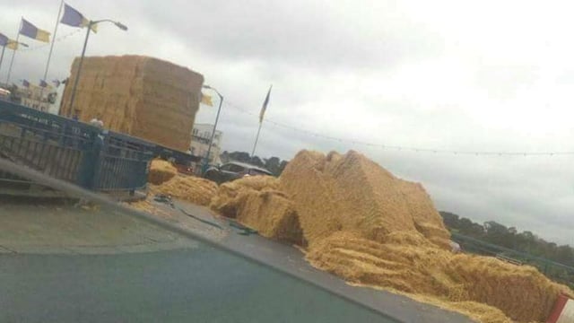 Pic: Traffic chaos as truck partially loses its load of bales