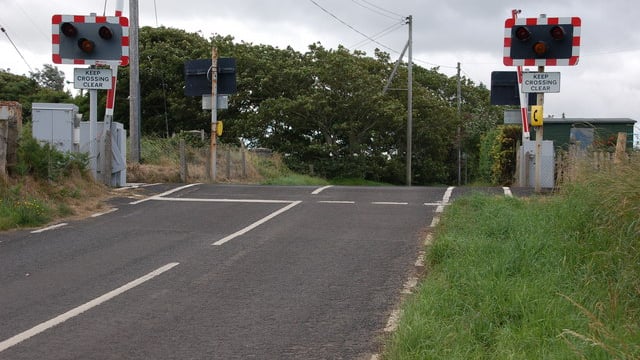Video: Speeding train narrowly avoids crashing into tractor at level crossing