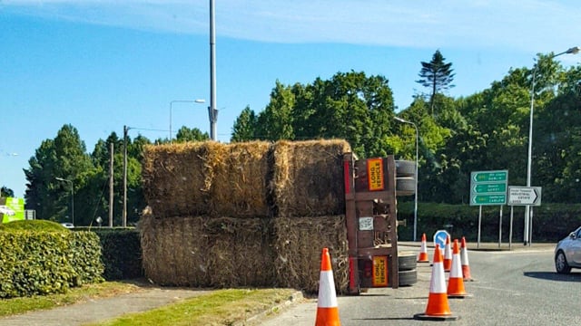 Pic: Trailer load of straw overturns at roundabout in Wexford