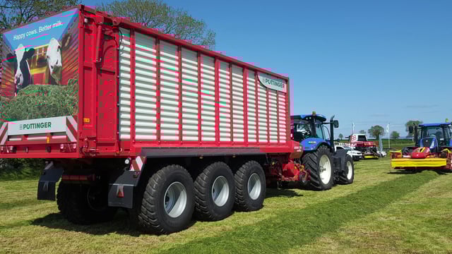 Grass & Muck: 3-axle monster flies flag for wagon fanatics