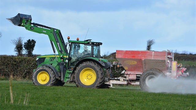 What are the benefits of correcting soil pH through lime?