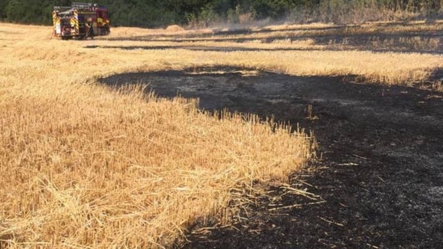 Sparks from combine blade ignites field fire