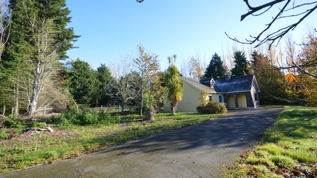 Residential roadside property offers access to beaches