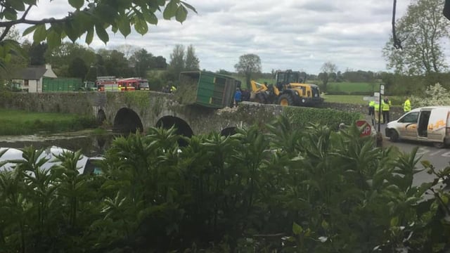 Narrow escape as silage trailer overturns on bridge