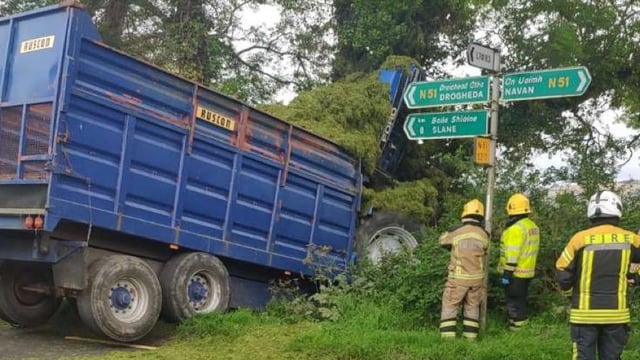 Crane brought in to extract tractor from collision scene