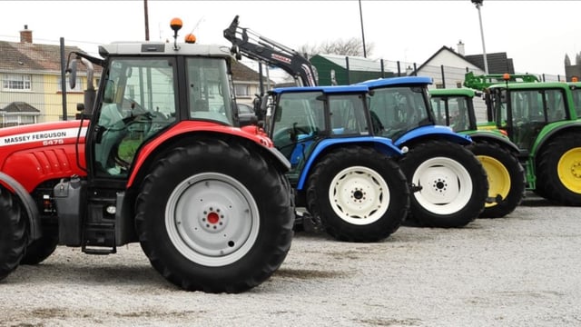 How many tractors were licensed during 2021?