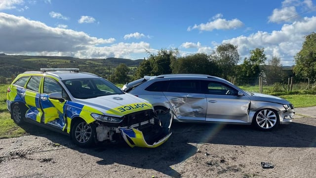 Tractor driver arrested for attempted murder after ramming 3 police cars