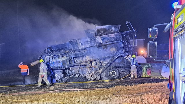 Fire crews and farmers tackle combine blaze in the UK